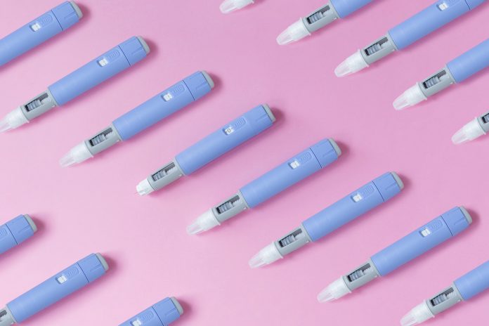 Medical,Drug,Ozempic,Injection,Lies,On,A,Pink,Background,,Top